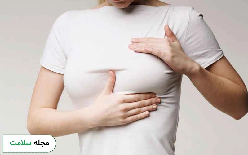 وجود توده سفت در سینه از نشانههای سرطان سینه در دختران است.